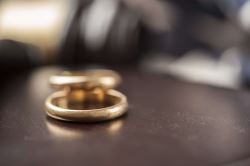 Two wedding rings sit on a lawyer's desk